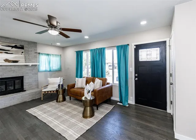 a living room with furniture and a fireplace