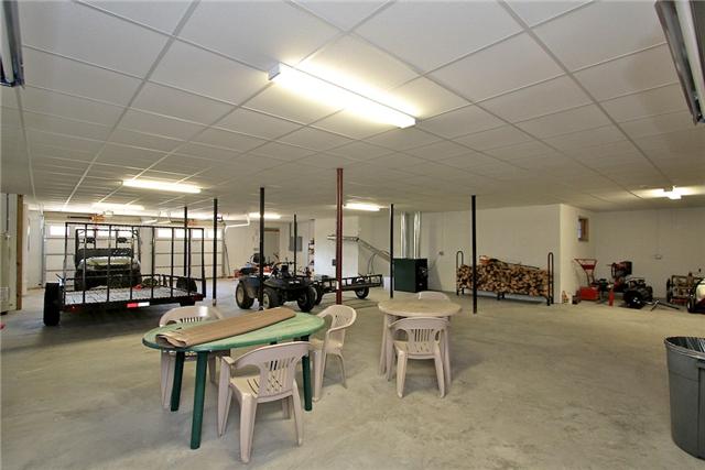 1214 Ben Collier Road Charlotte, TN 37036 - Photo 15 of 20 a room with lots of tables a large window and chairs