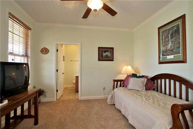 1214 Ben Collier Road Charlotte, TN 37036 - Photo 7 of 20 a bedroom with a bed and a flat screen tv