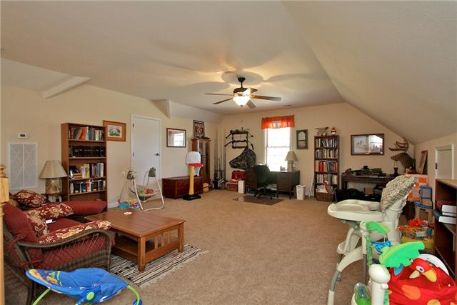 1214 Ben Collier Road Charlotte, TN 37036 - Photo 10 of 20 a living room with furniture a chandelier and a dining table