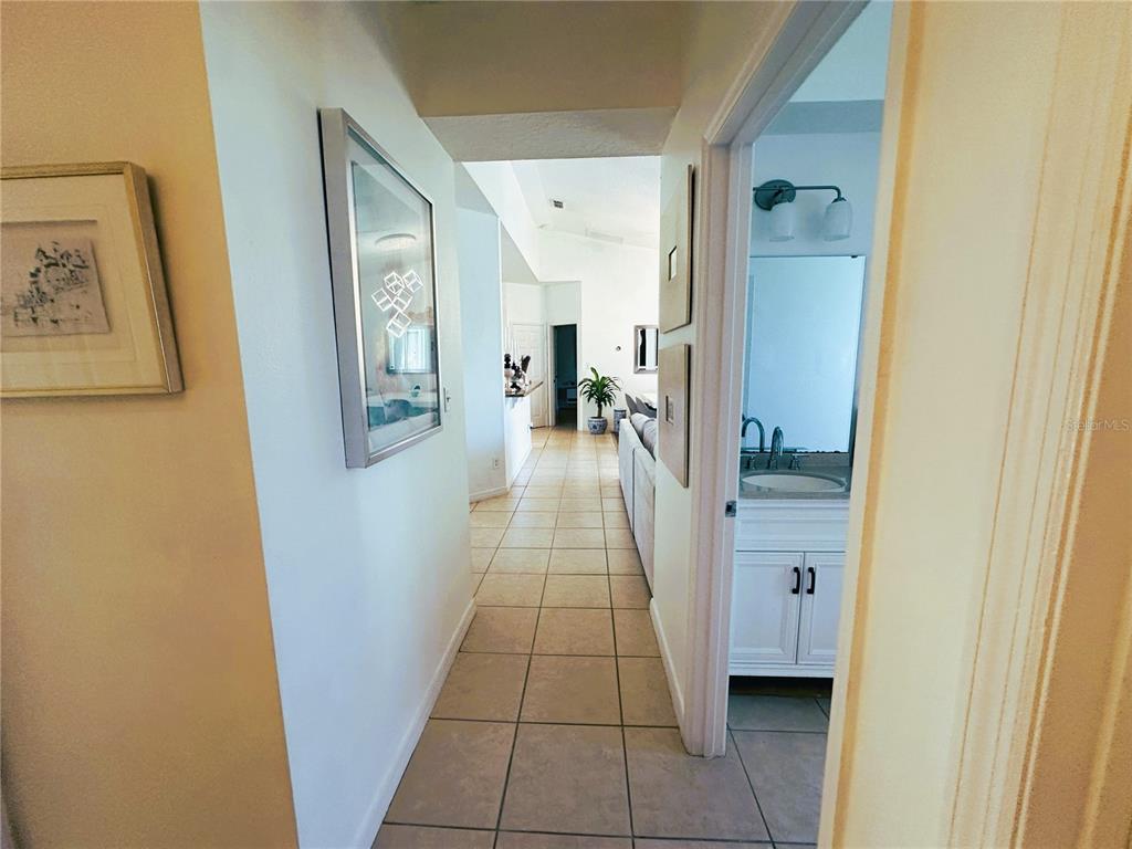 700 Castillo Place St. Cloud, FL 34769 - Photo 24 of 43 a view of a hallway view with wooden floor and living room