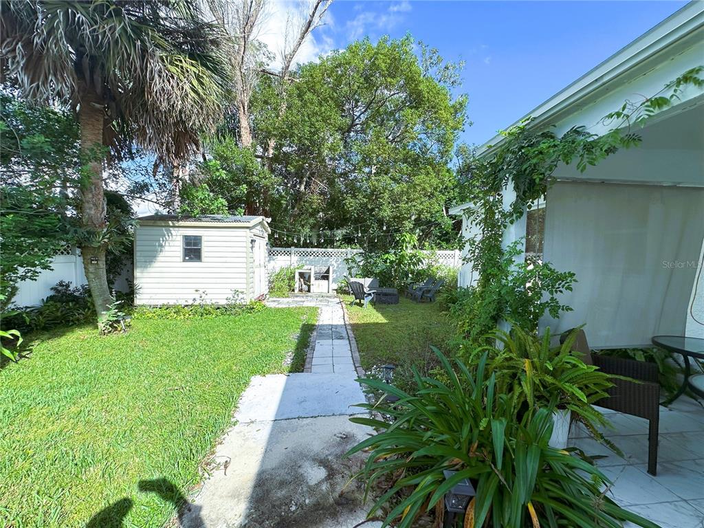 700 Castillo Place St. Cloud, FL 34769 - Photo 27 of 43 a front view of a house with garden