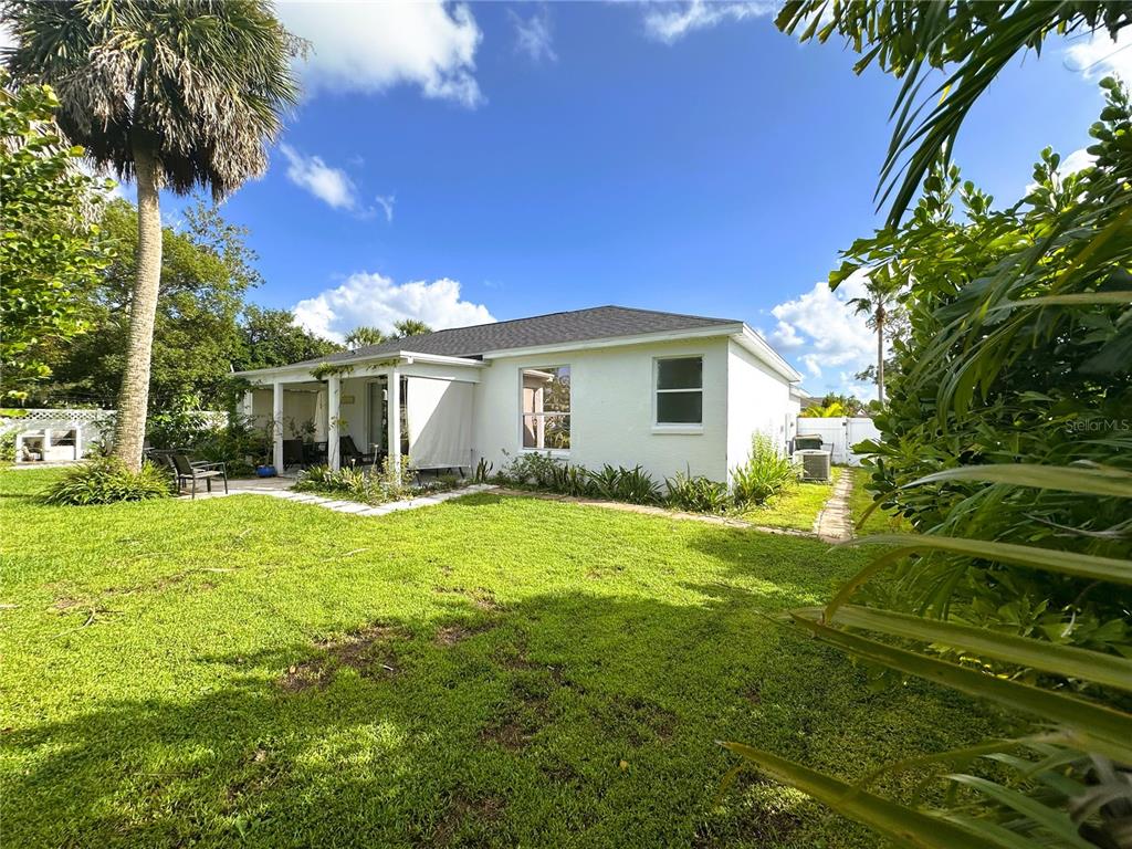 700 Castillo Place St. Cloud, FL 34769 - Photo 35 of 43 a view of a house with backyard and garden