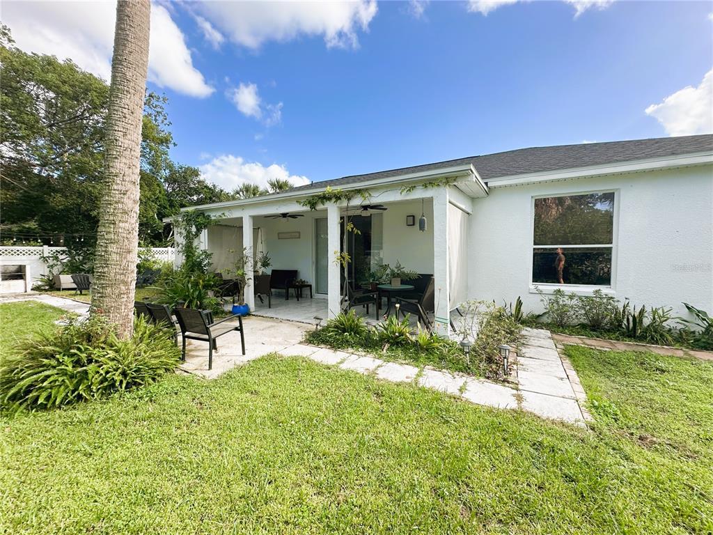 700 Castillo Place St. Cloud, FL 34769 - Photo 39 of 43 a view of house with backyard and porch
