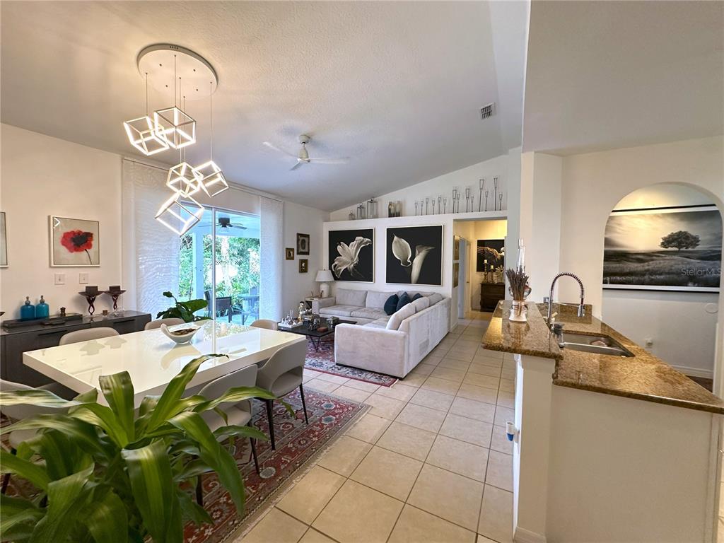 700 Castillo Place St. Cloud, FL 34769 - Photo 4 of 43 a living room with fireplace furniture and a chandelier