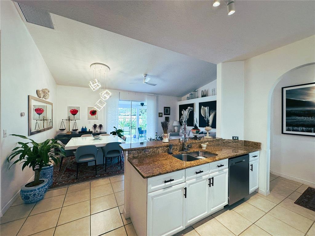 700 Castillo Place St. Cloud, FL 34769 - Photo 8 of 43 a kitchen that has a lot of cabinets a sink and a stove in it