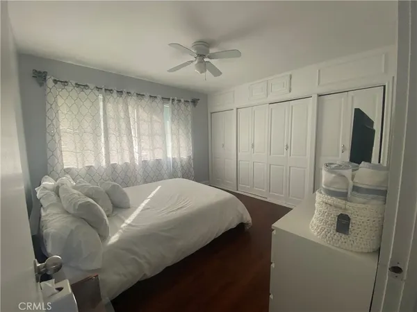 a bed room with a bed window and a couch