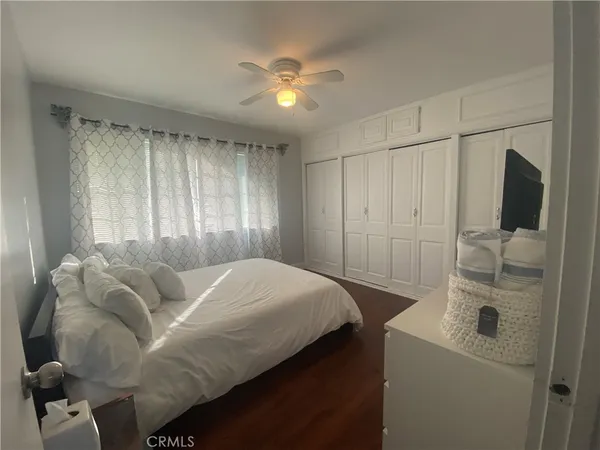 a bed room with a bed and a television