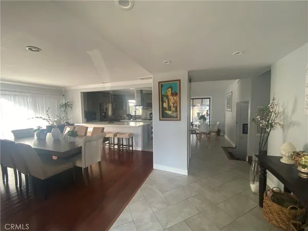 a living room with furniture a dining table and chairs