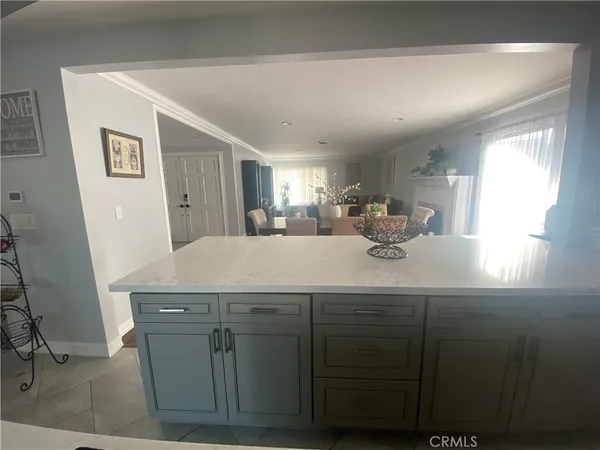 a kitchen with a sink a counter space and a window