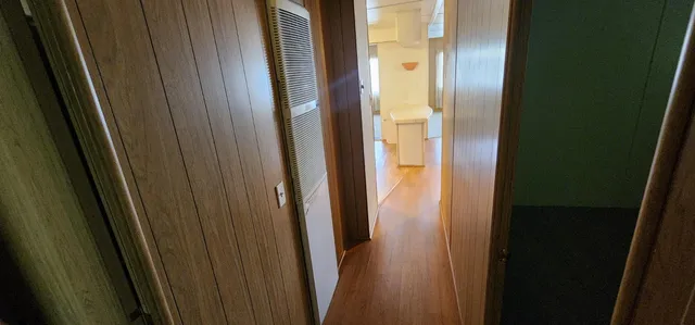 a view of a bathroom from a hallway