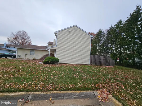 a view of a patio with a table and chairs