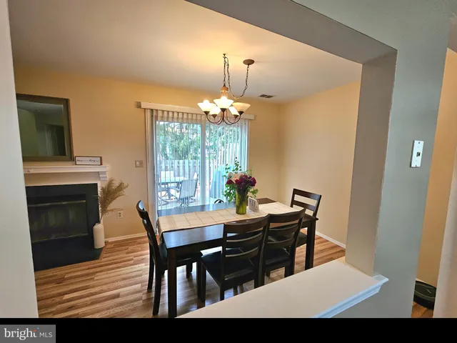 a living room with a fireplace furniture and a wooden floor