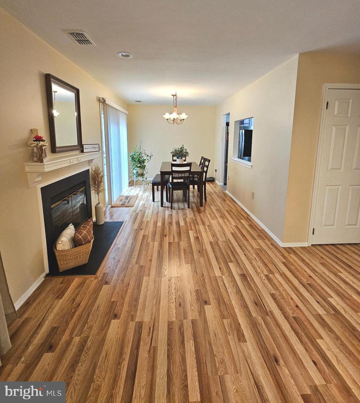 17 Exeter Court Bordentown, NJ 08505 - Photo 5 of 19 a living room with a fireplace furniture and a wooden floor