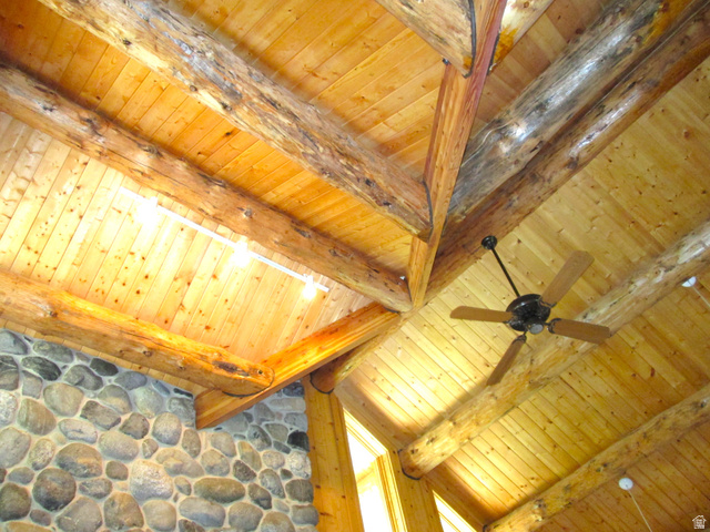 6210 Mountain View Road, Unit 133 Coalville, UT 84017 - Photo 25 of 87 Detailed view of the vaulted great room ceiling with exposed log beams and a remote controlled ceiling fan.