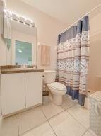 780 2nd Street Southwest Vero Beach, FL 32962 - Photo 12 of 21 a bathroom with a sink a toilet and a mirror