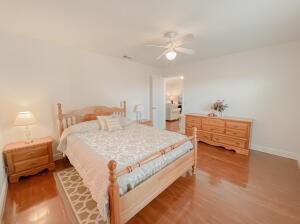 780 2nd Street Southwest Vero Beach, FL 32962 - Photo 13 of 21 a bedroom with a bed and a chandelier