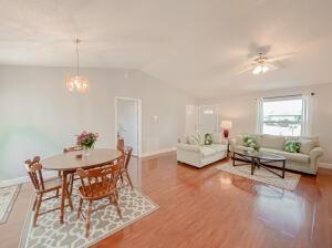 780 2nd Street Southwest Vero Beach, FL 32962 - Photo 3 of 21 a living room with furniture a chandelier and a window
