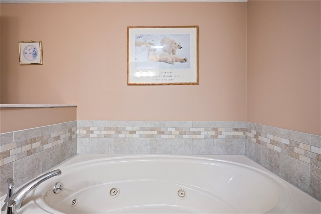 7 Primmett Lane, Unit 7 Worcester, MA 01609 - Photo 34 of 38 a white bath tub and a shower