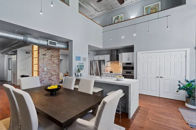 a kitchen with a sink and a large window