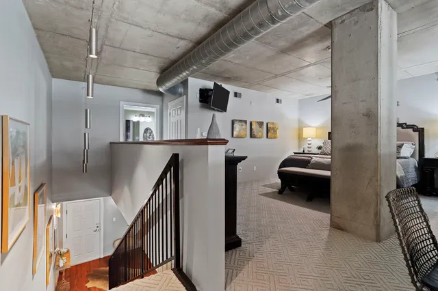 a bedroom with a bed and a couch