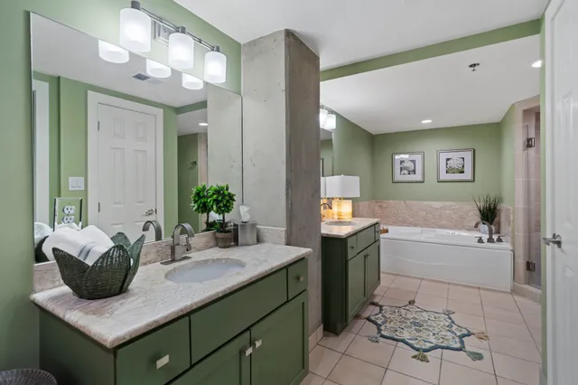 a bathroom with a bathtub and a shower