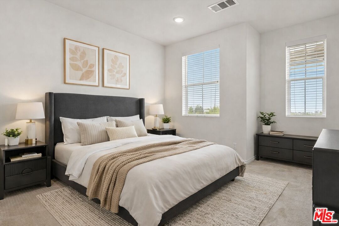 17923 Goodyear Carson, CA 90746 - Photo 15 of 17 a bedroom with a bed and a closet