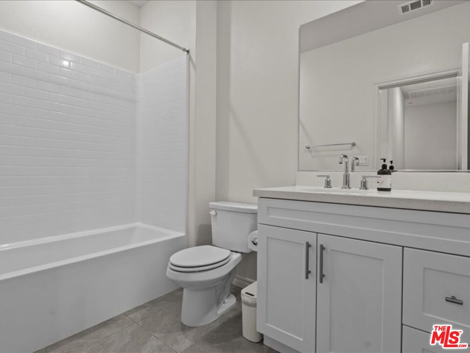 17923 Goodyear Carson, CA 90746 - Photo 7 of 17 a bathroom with a sink a toilet and shower