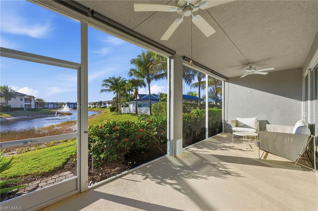6980 Avalon Circle, Unit 1102 Naples, FL 34112 - Photo 14 of 24 Sunroom with a ceiling fan and a water view