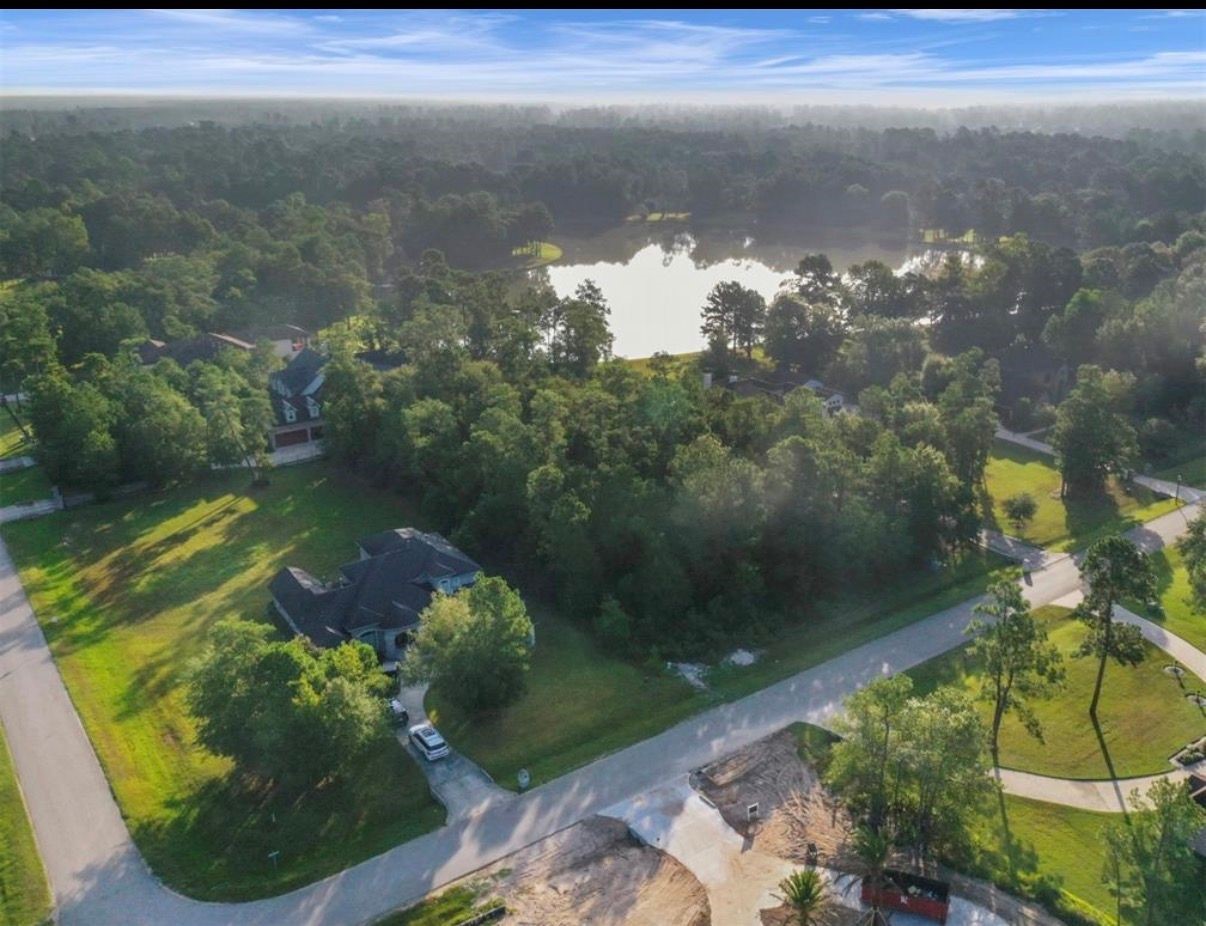 4007 Hidden Winds Drive Spring, TX 77386 - Photo 7 of 9 a view of a lake from a yard