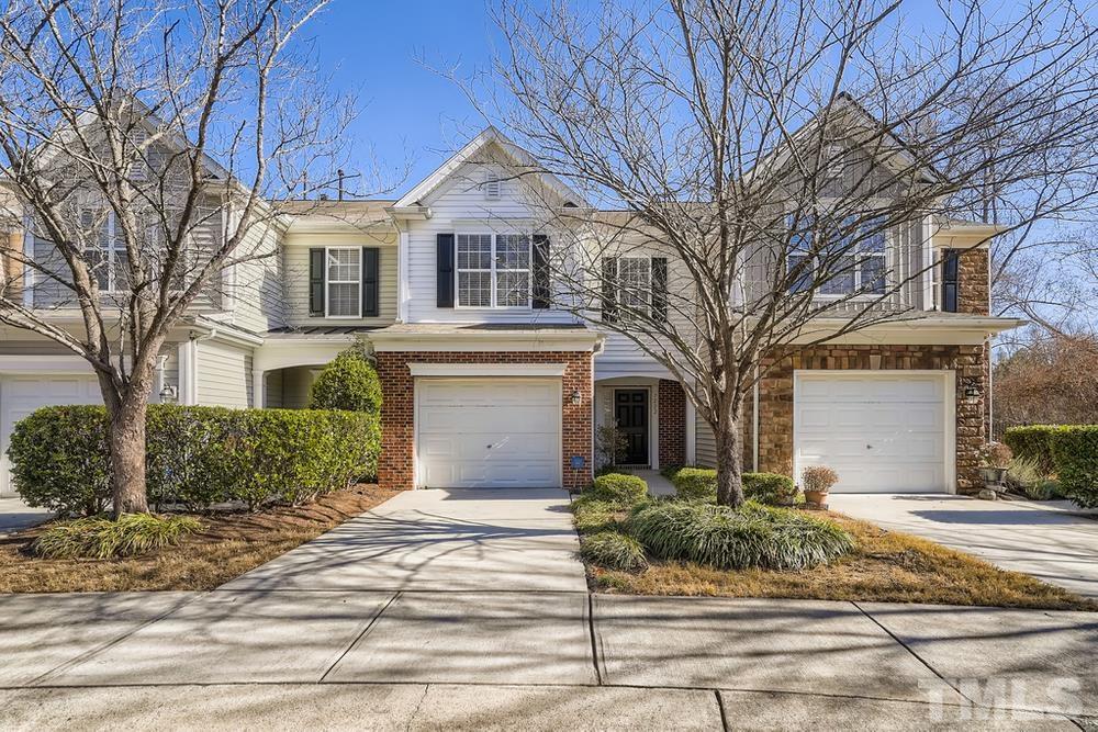7222 Racine Way Raleigh, NC 27615 - Photo 1 of 27 a front view of a house with a yard and potted plants