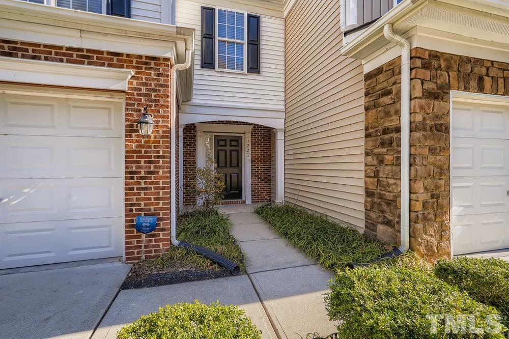 7222 Racine Way Raleigh, NC 27615 - Photo 4 of 27 a front view of a house with a yard