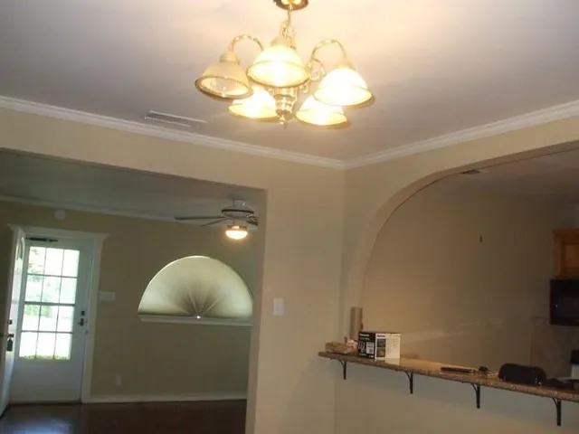 a view of a chandelier and a chandelier fan