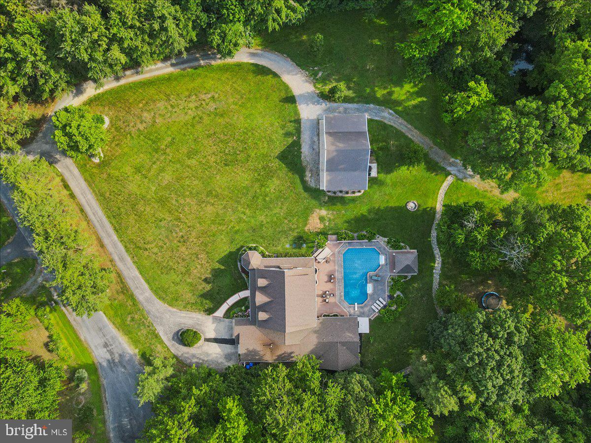 102 Little Neck Road Stevensville, MD 21666 - Photo 72 of 77 an aerial view of a house with a garden and swimming pool