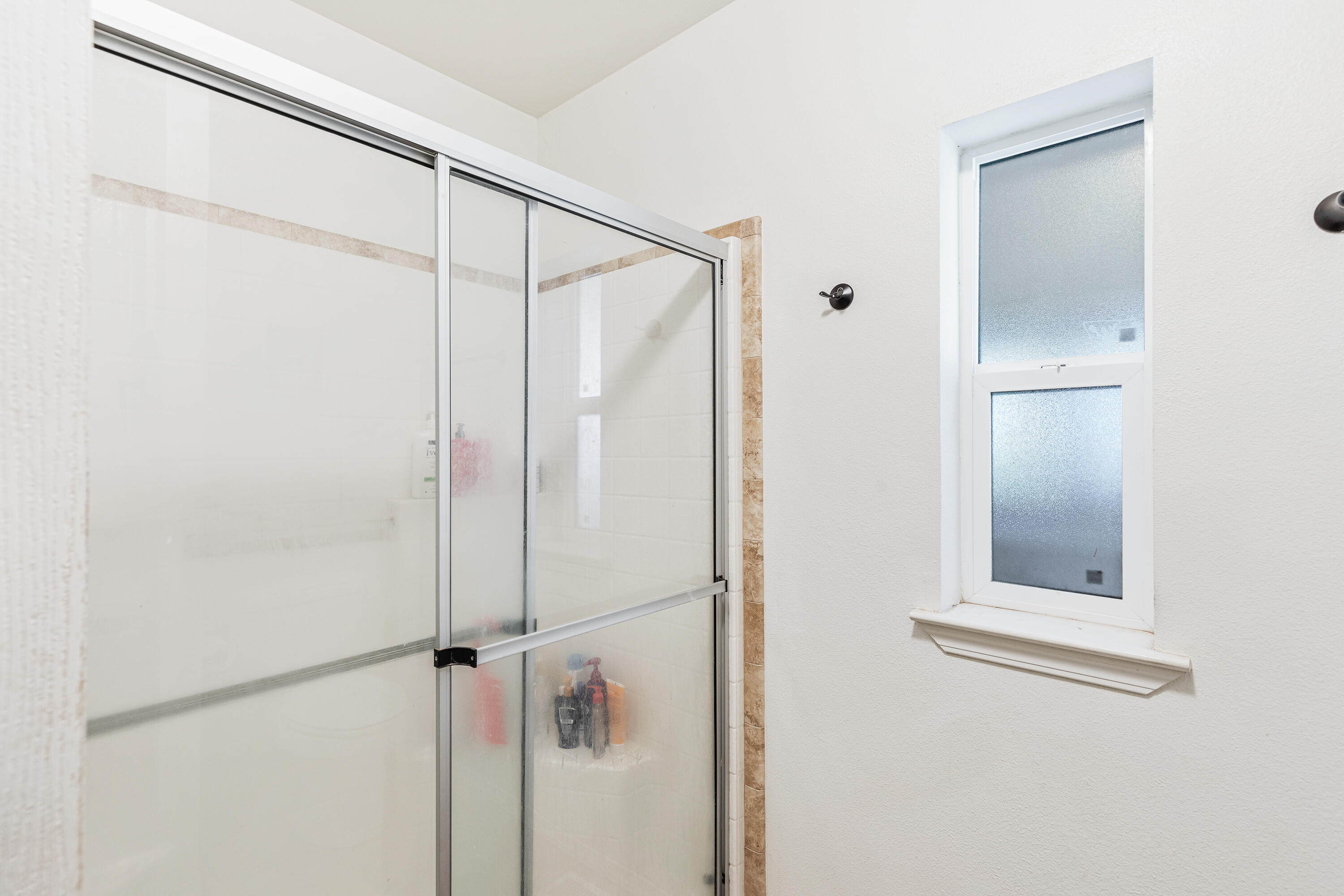 13721 Upper Applegate Road Jacksonville, OR 97530 - Photo 13 of 26 a bathroom with a glass shower door