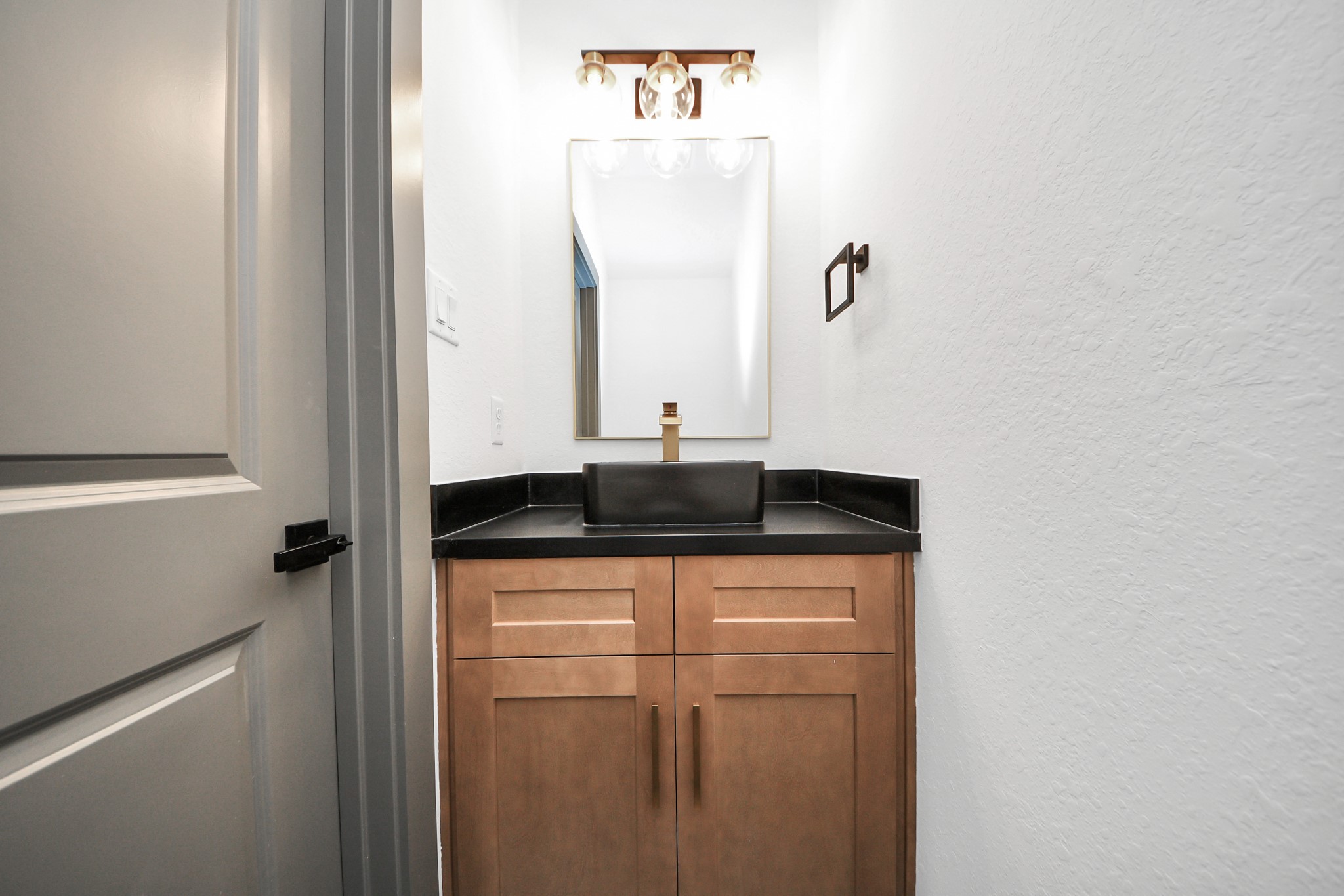 7925 Ritz Street, Unit B Houston, TX 77028 - Photo 11 of 35 a close view of a sink and mirror