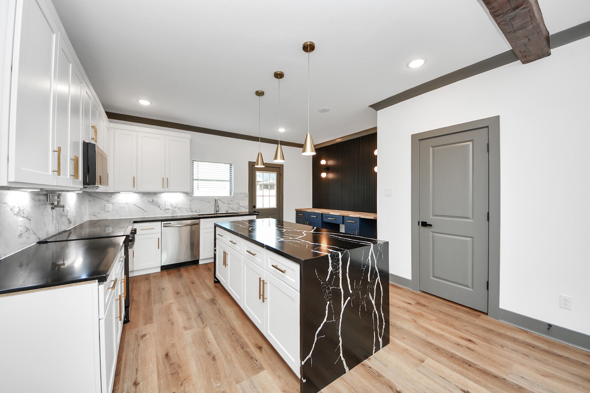 7925 Ritz Street, Unit B Houston, TX 77028 - Photo 15 of 35 a kitchen with stainless steel appliances granite countertop a sink a stove and a refrigerator