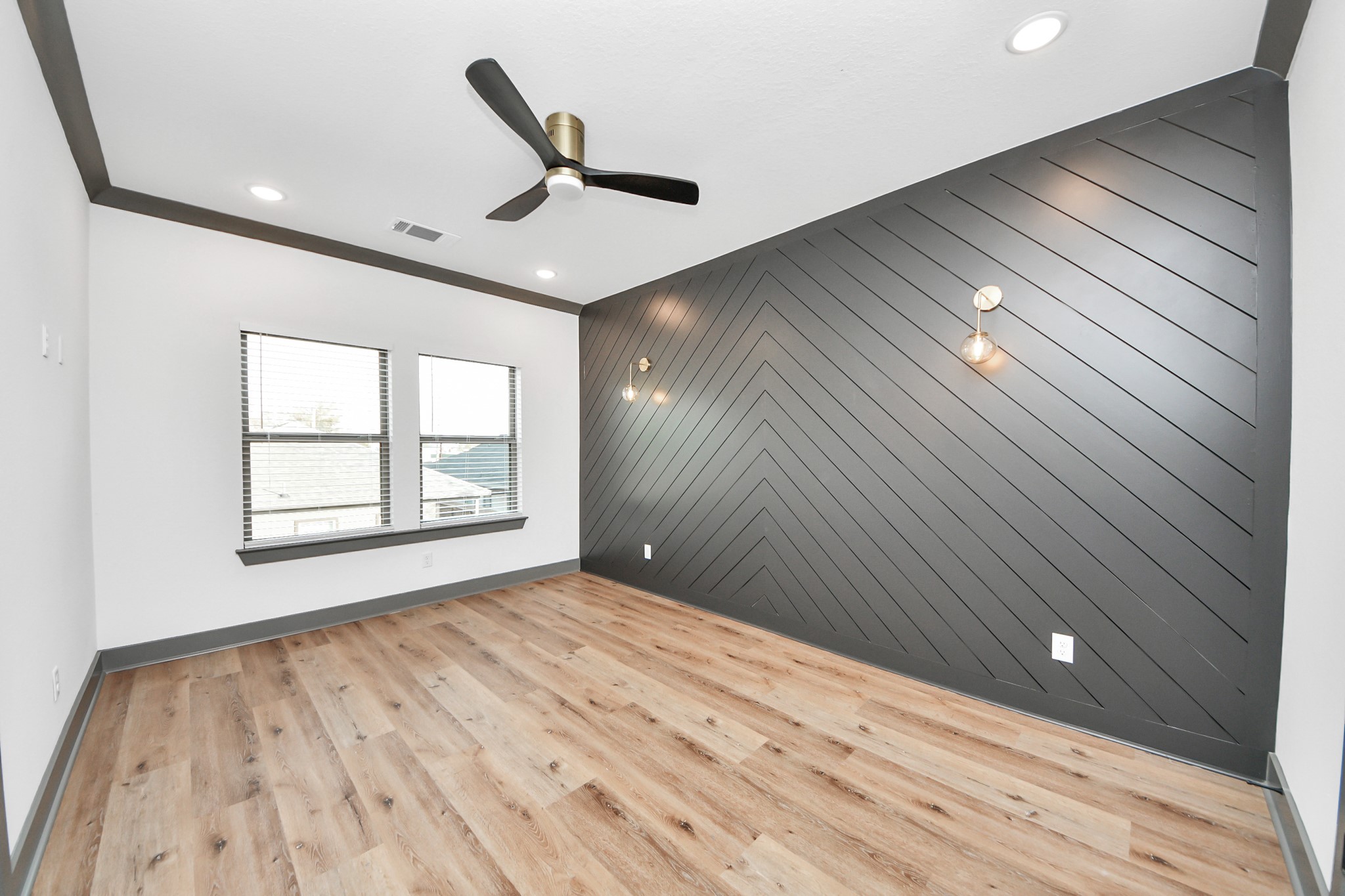 7925 Ritz Street, Unit B Houston, TX 77028 - Photo 21 of 35 a view of an empty room with wooden floor and a window