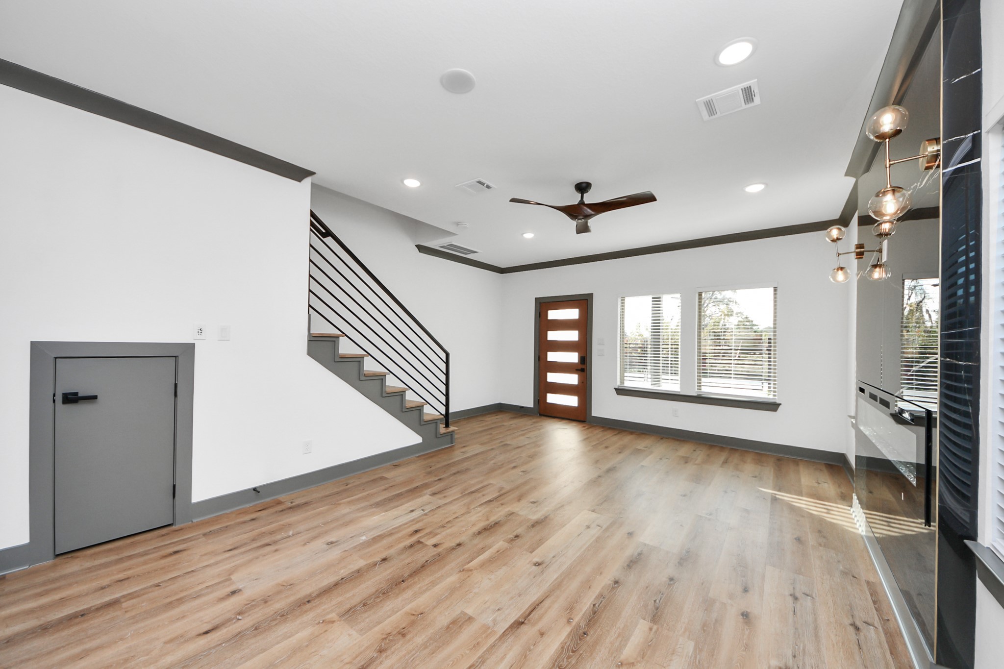 7925 Ritz Street, Unit B Houston, TX 77028 - Photo 8 of 35 a view of an empty room with wooden floor and a window