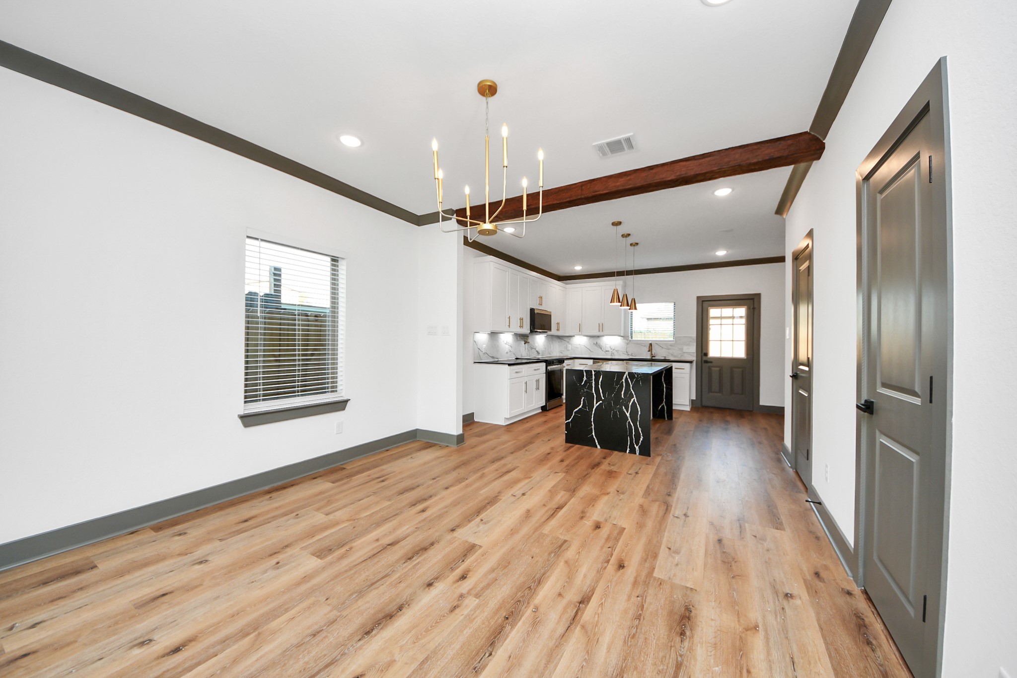 7925 Ritz Street, Unit B Houston, TX 77028 - Photo 10 of 35 a view of a kitchen with a sink and wooden floor