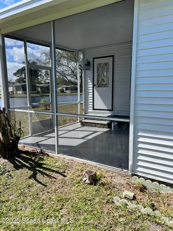 a view of a lounge chair in the backyard