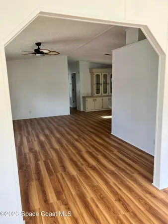 a view of a big room with closet and chandelier