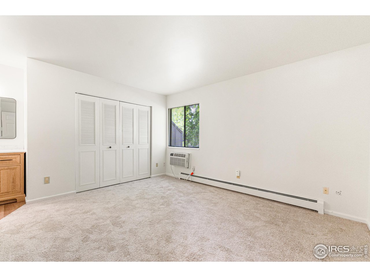 705 East Drake Road, Unit 35 Fort Collins, CO 80525 - Photo 12 of 34 an empty room with windows