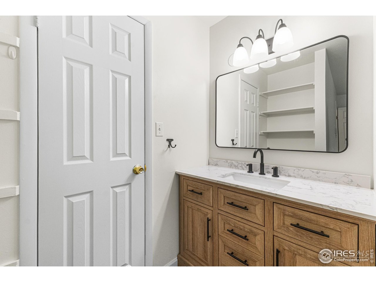 705 East Drake Road, Unit 35 Fort Collins, CO 80525 - Photo 14 of 34 a bathroom with a double vanity sink and a mirror