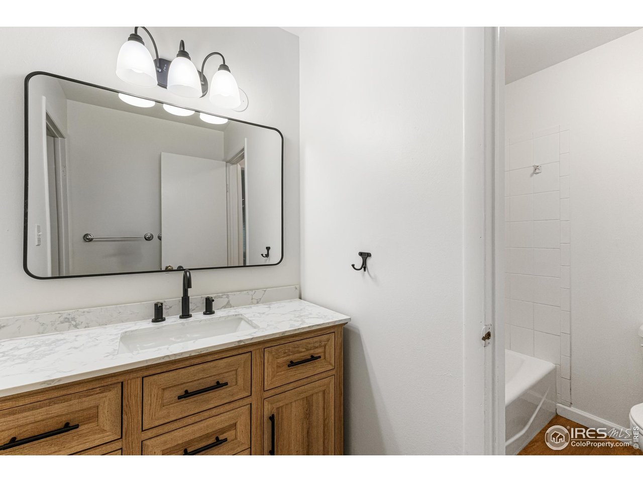 705 East Drake Road, Unit 35 Fort Collins, CO 80525 - Photo 16 of 34 a bathroom with a sink and a mirror