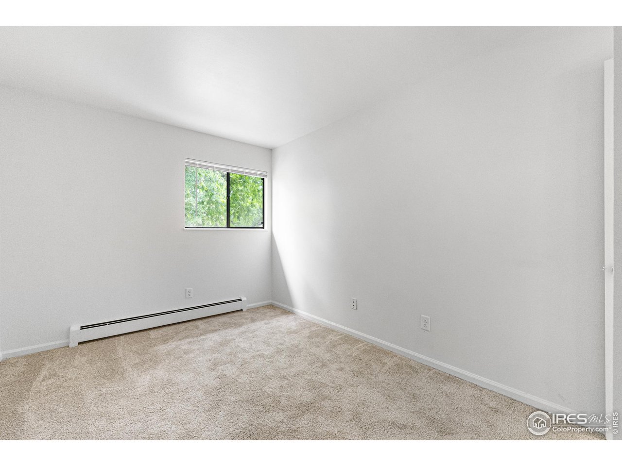 705 East Drake Road, Unit 35 Fort Collins, CO 80525 - Photo 20 of 34 an empty room with windows