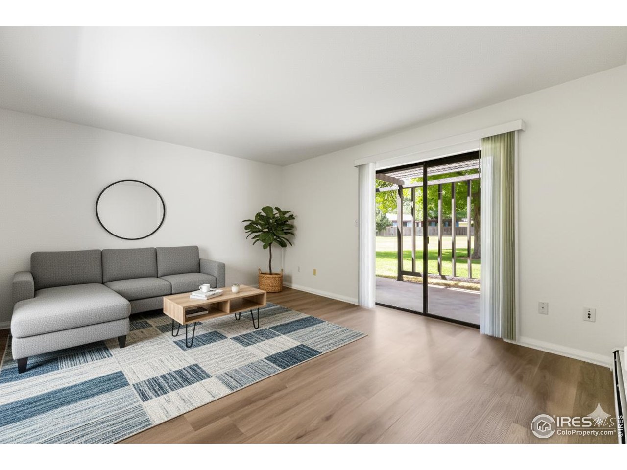 705 East Drake Road, Unit 35 Fort Collins, CO 80525 - Photo 3 of 34 a living room with furniture rug and window