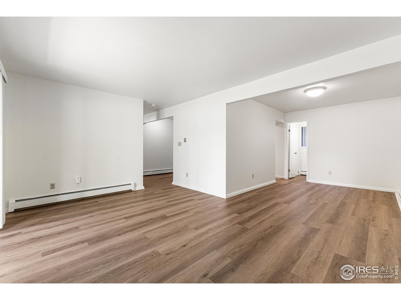 705 East Drake Road, Unit 35 Fort Collins, CO 80525 - Photo 9 of 34 a view of an empty room and wooden floor