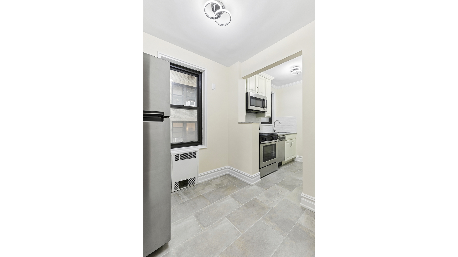345 Riverside Drive, Unit 1E Manhattan, NY 10025 - Photo 11 of 15 a view of kitchen with furniture and refrigerator