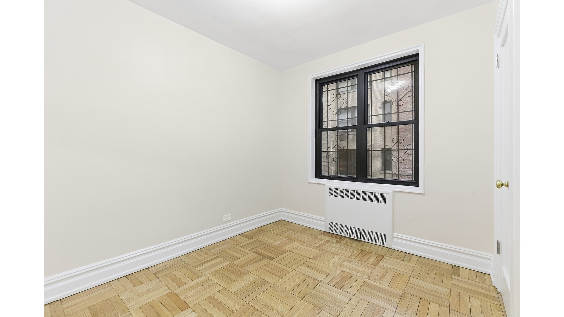 345 Riverside Drive, Unit 1E Manhattan, NY 10025 - Photo 12 of 15 a view of an empty room with a window